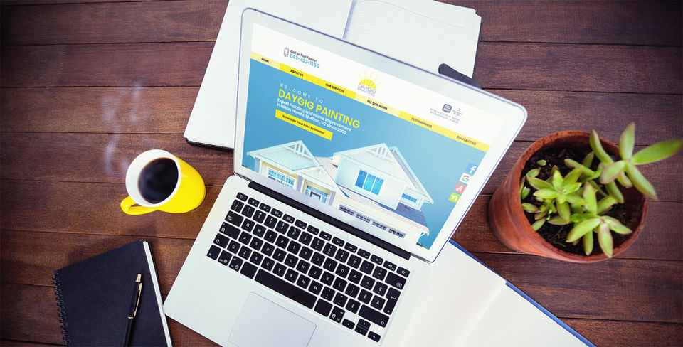 Daygig Painting website homepage displayed on a laptop with notebook and coffee