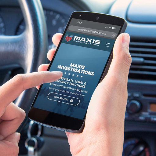 Mobile phone displaying Maxis Investigations' website.