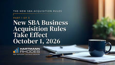 Title slide for The New SBA Acquisition Rules, Part 1 of 3, with office desk, coffee mug, notebook, and pen.