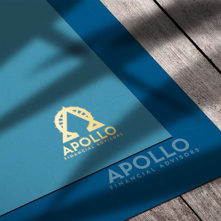 Close-up of the Apollo Financial Advisors logo applied to branded folders and print materials.