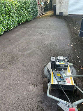 Driveway cleaning in Yeovil. Rotary cleaner on tarmac driveway..jpg