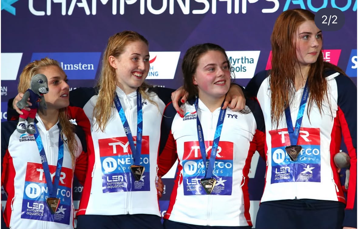 Holly Hibbott celebrating in the pool