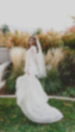 A bride twirls in her dress in front of the Mount Timpanogos Temple after their Temple Exit
