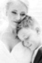 bride and bride's son embrace