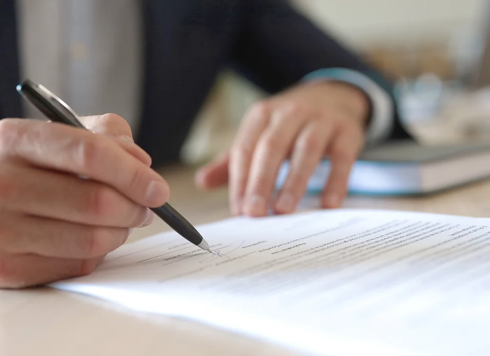 Man signing documents