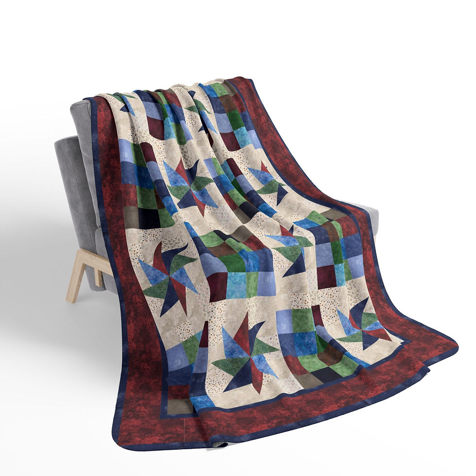 Quilted blanket draped over chair; star and square pattern design on display.