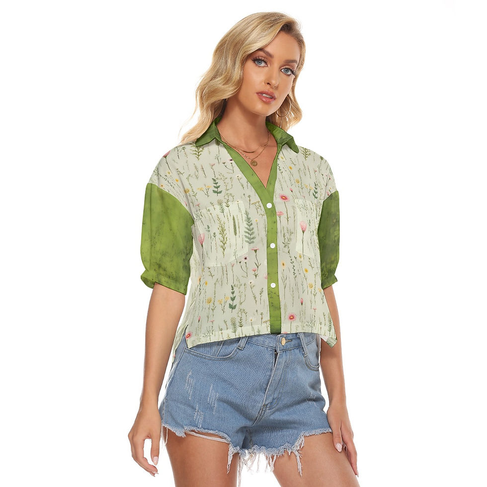 Woman wearing green shirt and denim shorts, posing for a product shot.
