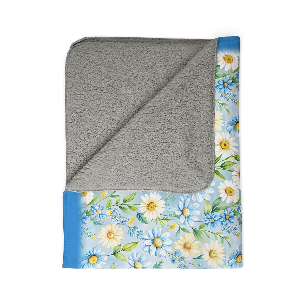 Thumbnail: Folded daisy-patterned blanket with blue trim and gray fleece interior on white backdrop.
