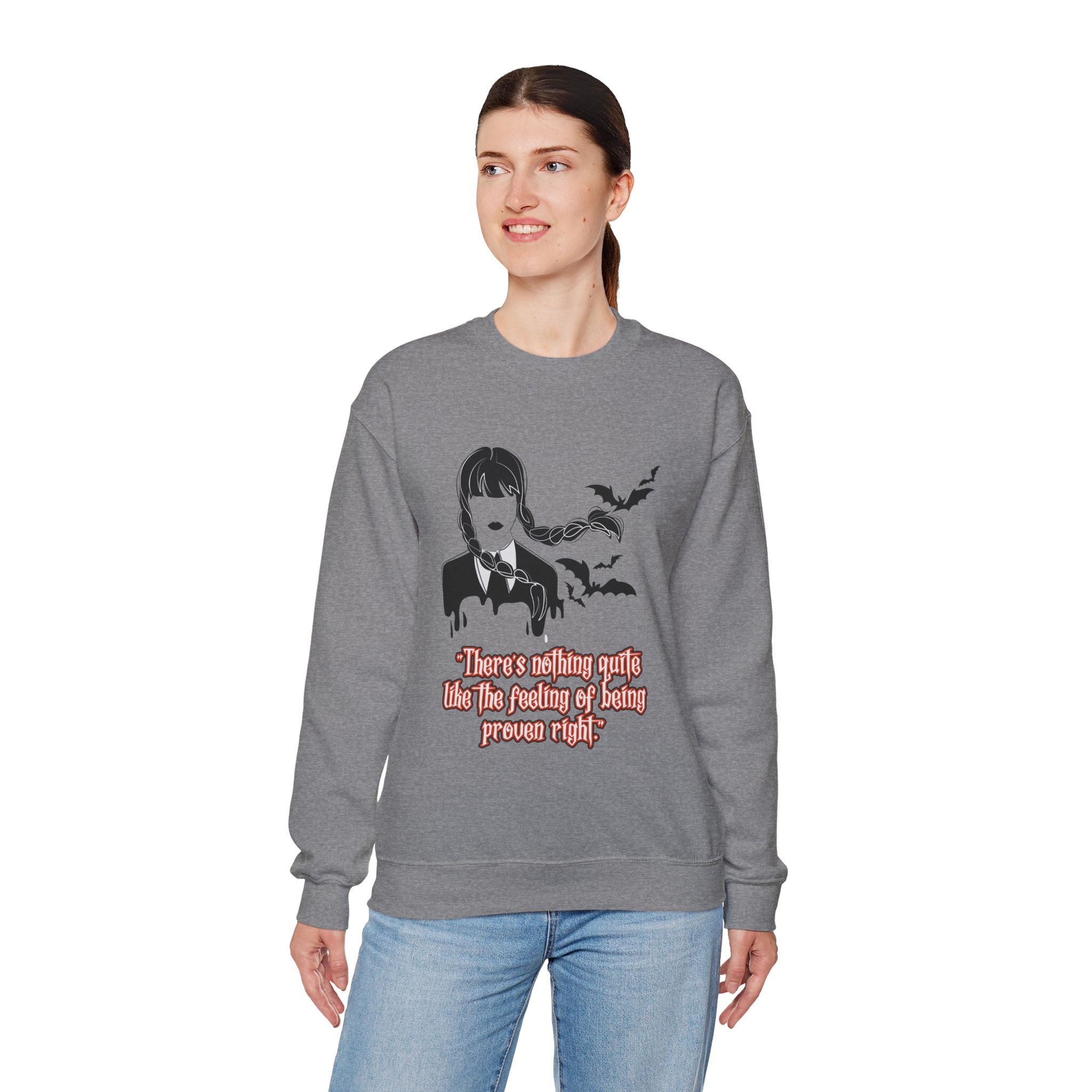 Woman wearing gray sweatshirt with Wednesday Addams graphic and text, Won't You Join Me for Dinner Crewneck Unisex Sweatshirt, Halloween Party Wear