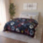 Floral pattern blanket on bed in bedroom setting with decor
