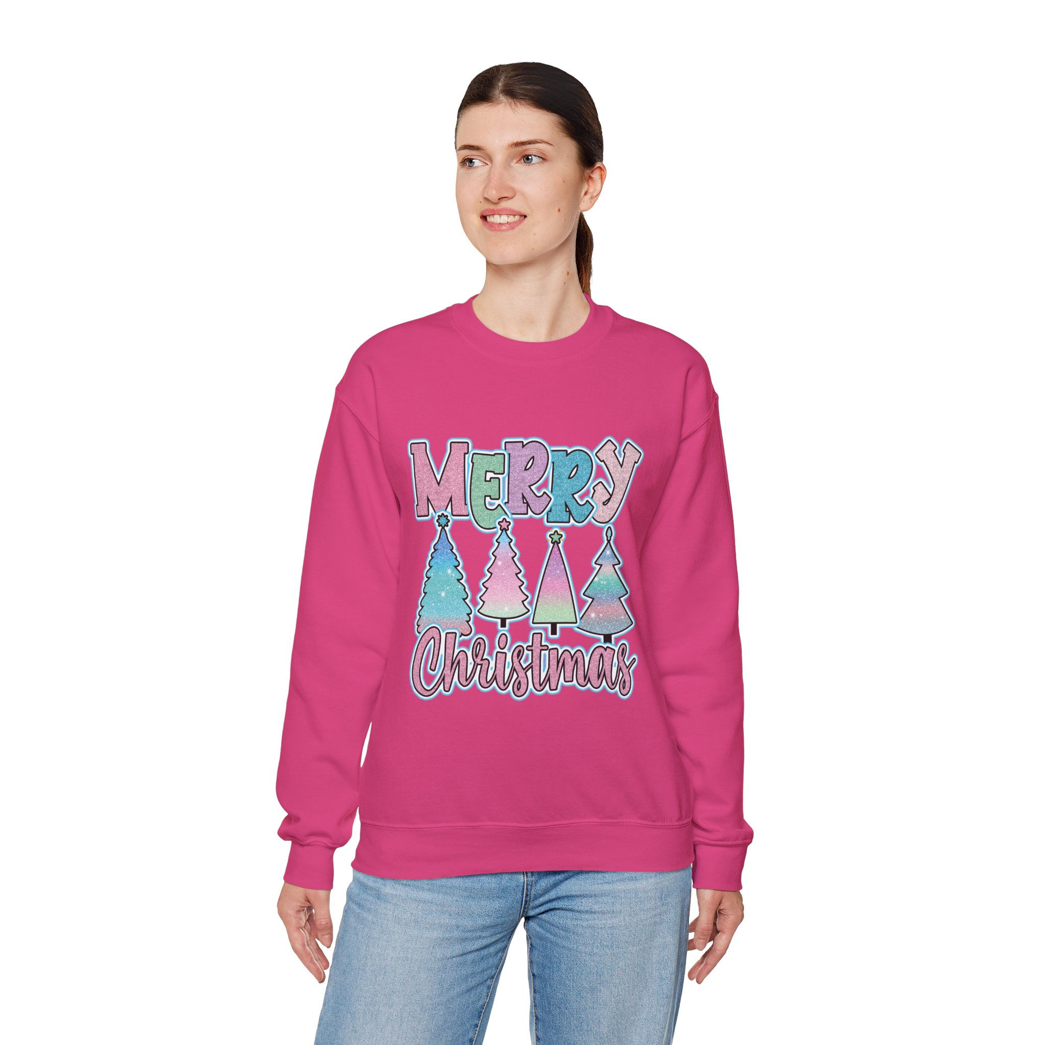 Woman wearing Whimsical Merry Christmas with Pastel Glitter Patterns and Trees Sweatshirt, smiling broadly.