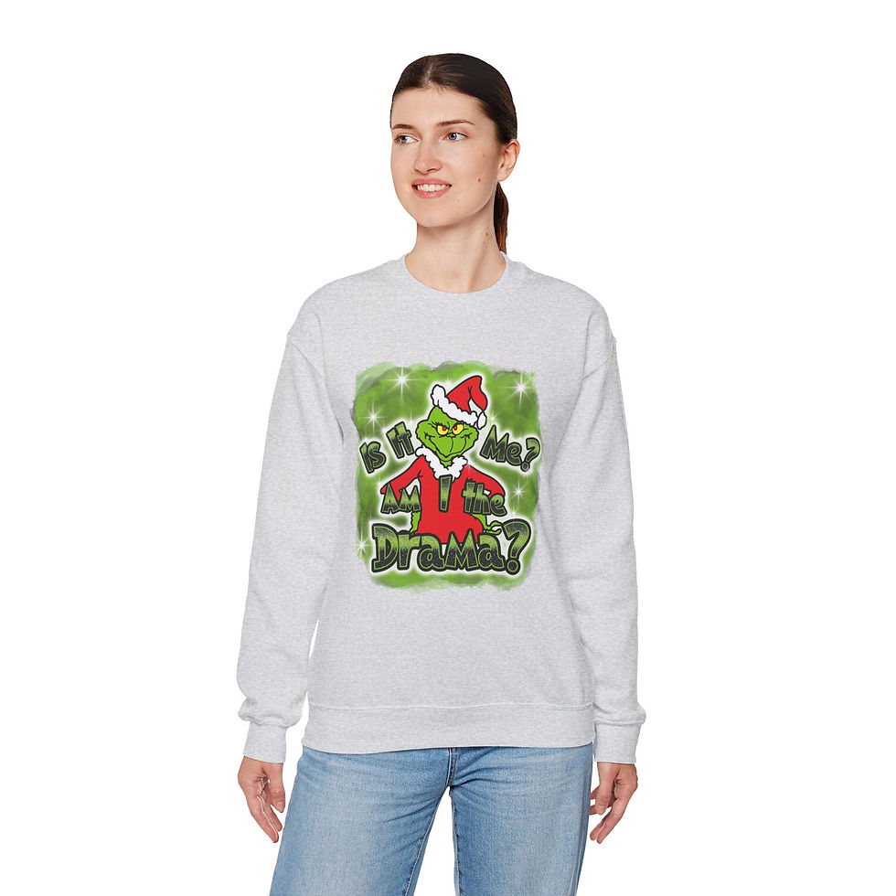 Thumbnail: Woman wearing Grinch Christmas sweatshirt smiling, 