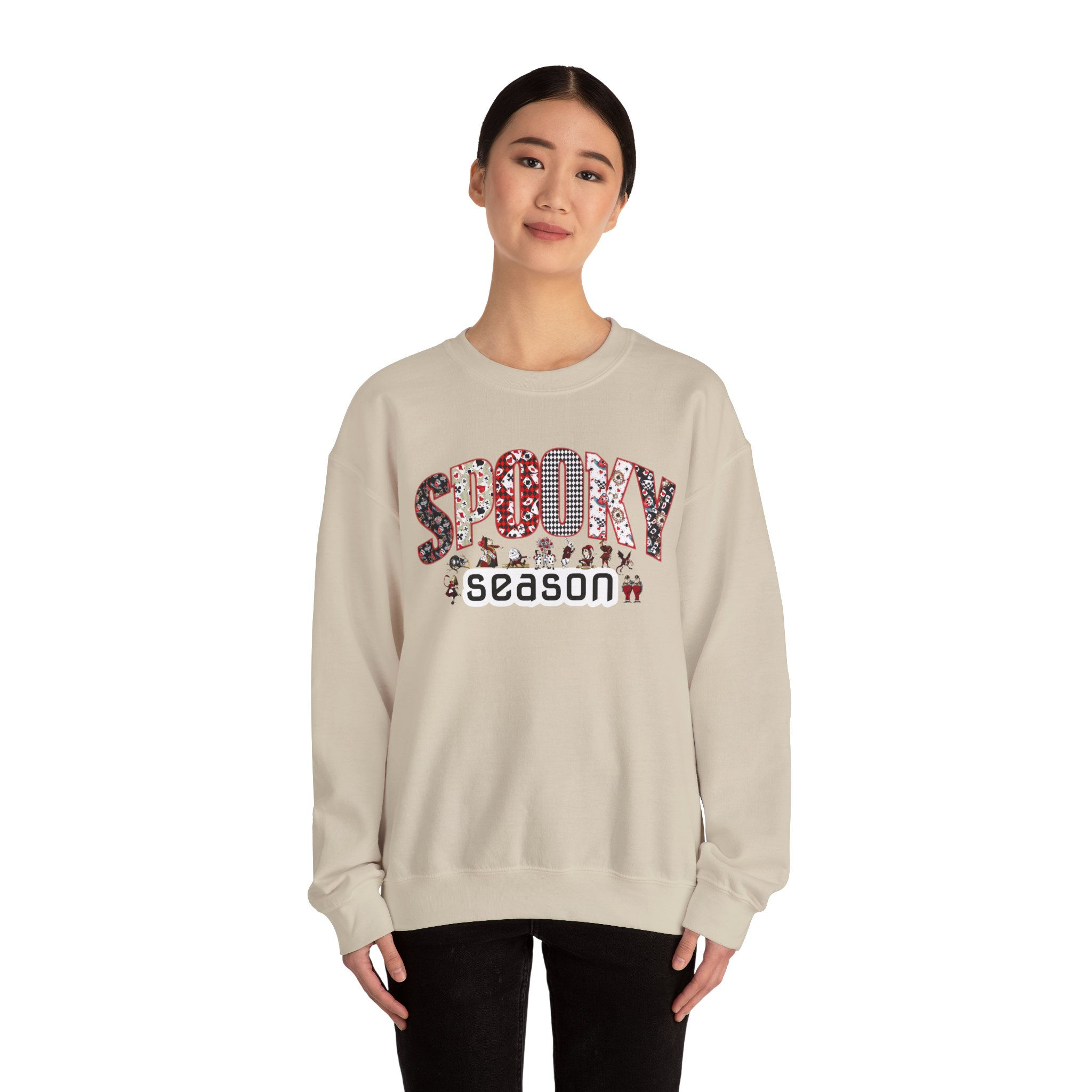 Woman wearing tan sweatshirt with "Sunday Season" text, floral design.