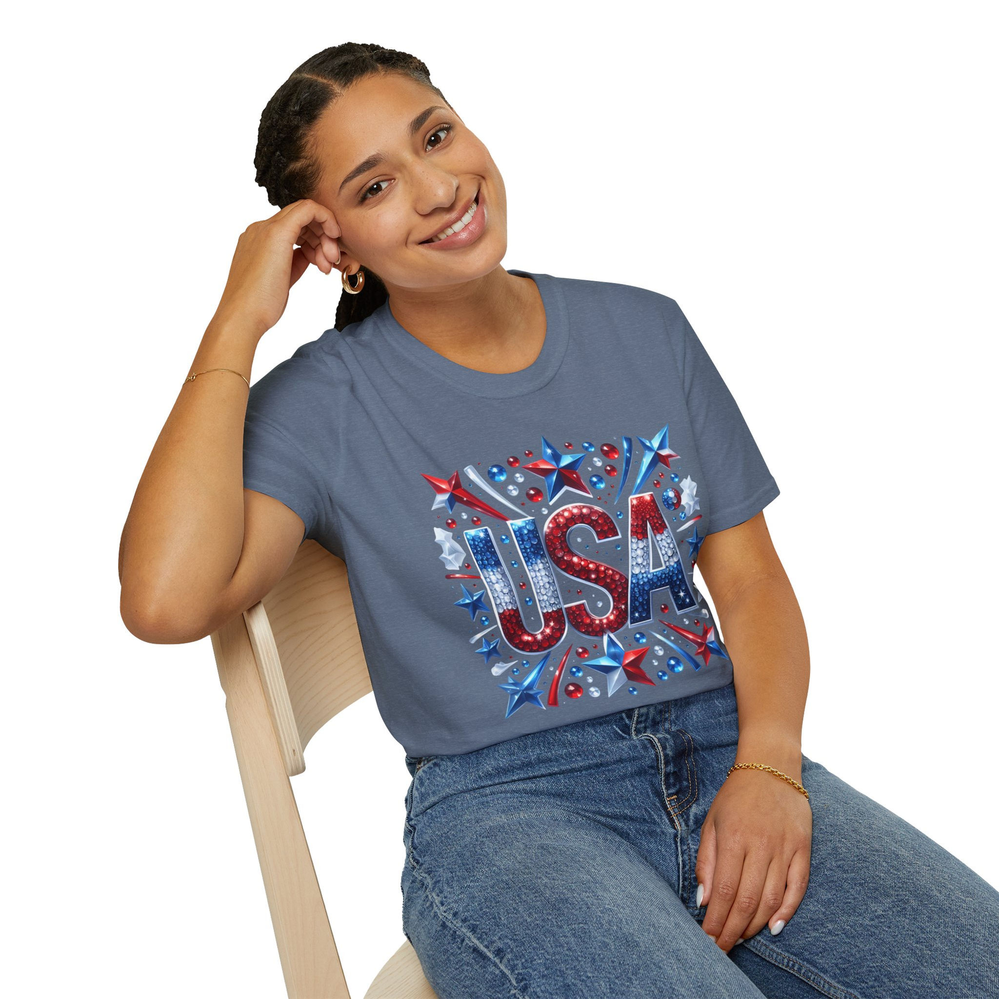Smiling woman wearing USA graphic tee shirt sitting on a chair.