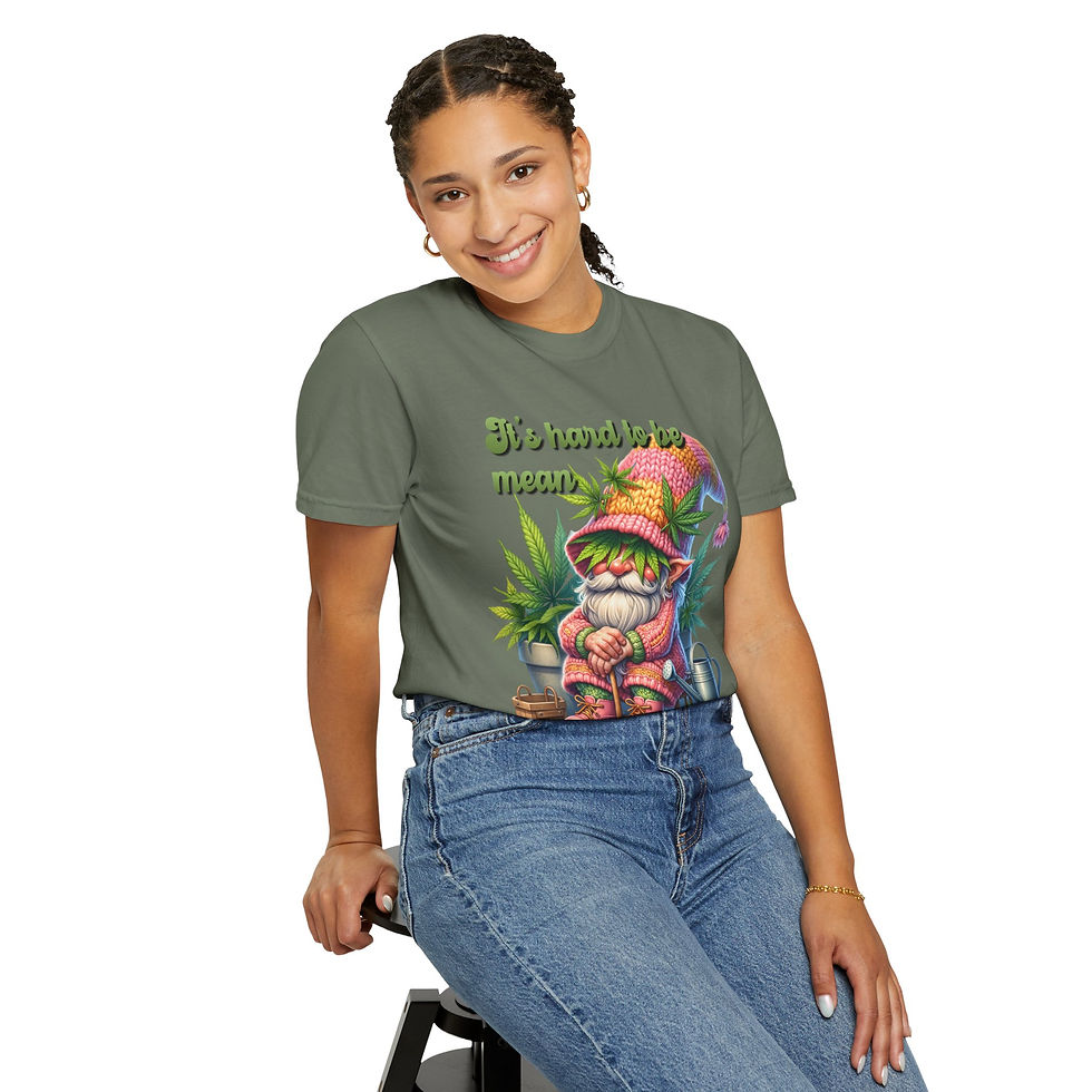 Thumbnail: Smiling woman wearing a green shirt with colorful gnome graphic print.