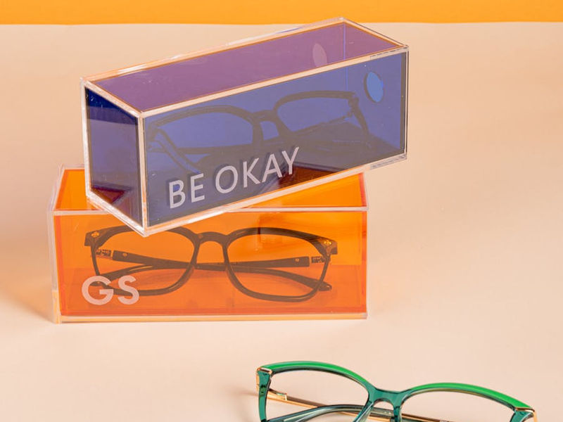 Bright and modern eyeglasses in neon boxes, perfect for a stylish accessory display.