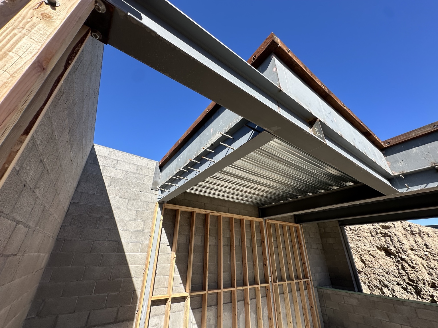 Steel beams integrated with wood framing