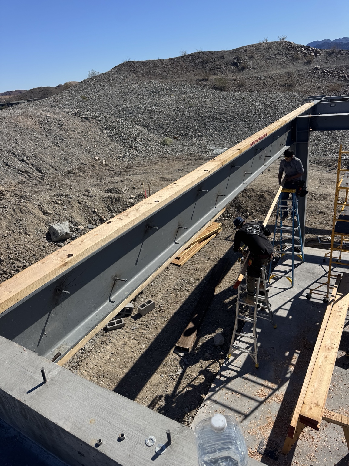 Crew working along a structural steel beam