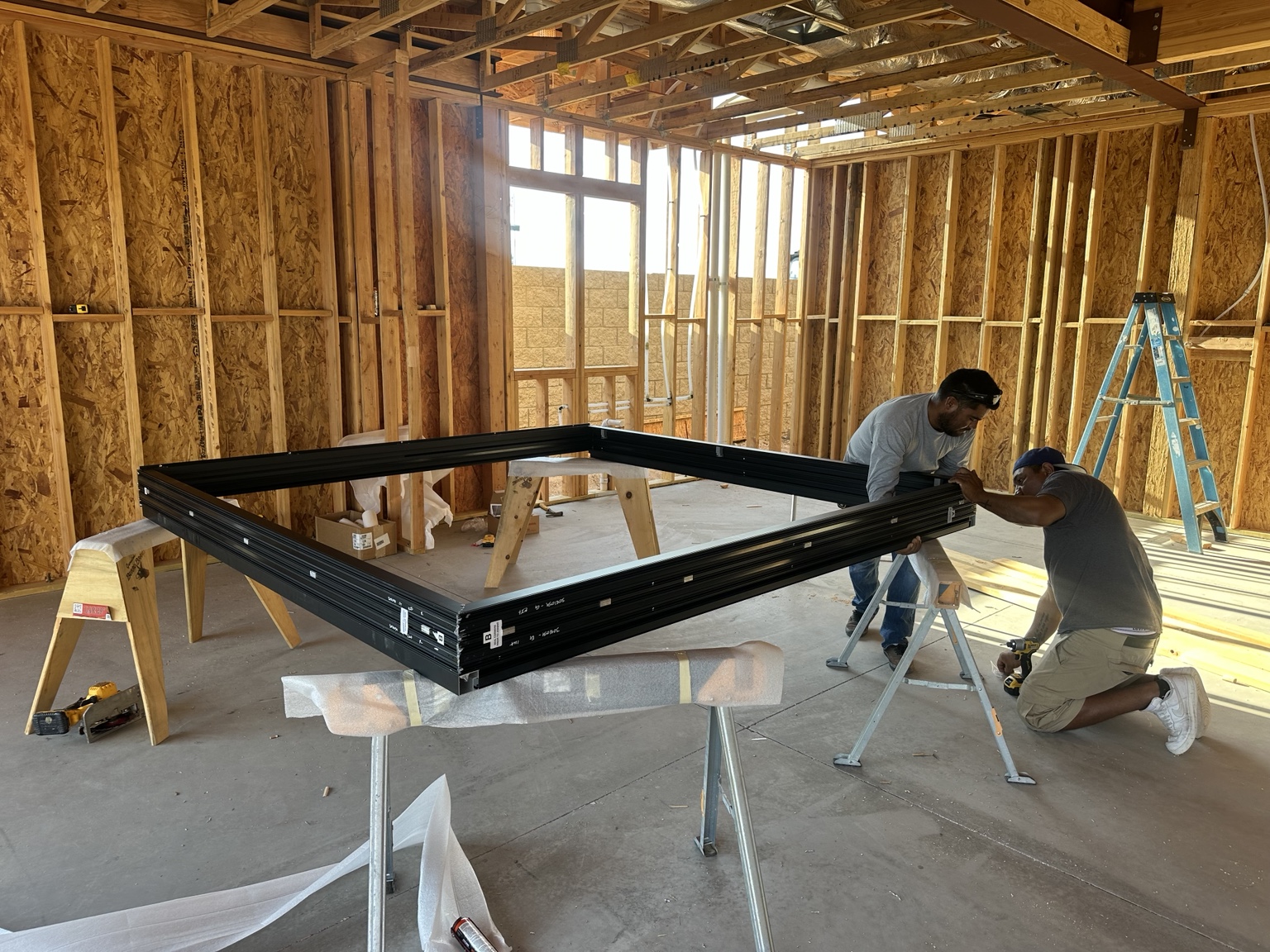 Crew preparing steel components in the field