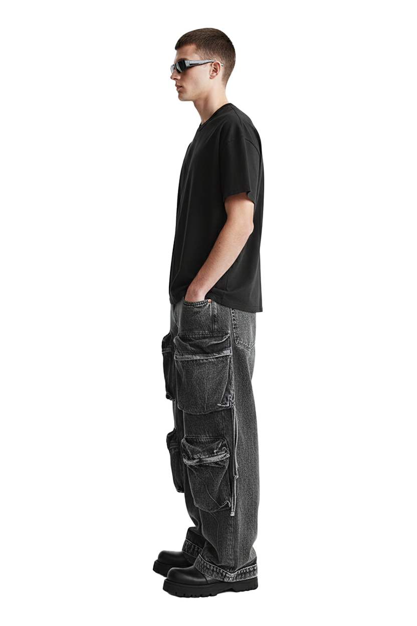 Man in black tee and cargo pants wearing sunglasses, side profile, isolated.