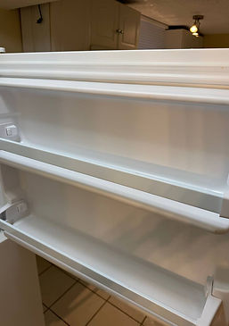 Refrigerator door shelves spotless and clean after service by Cleanphoria