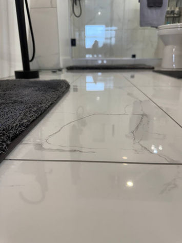 Spotless bathroom floor after deep cleaning — reflective tile shine by Cleanphoria.