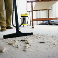Post renovation cleaning Person mopping wooden floor in bright home interior