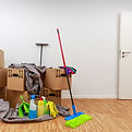 Move-In/Move-Out Cleaning Illustration of cleaning supplies including mop, bucket, and boxes for moving