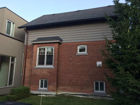 Mimico, Etobicoke - Exterior painting of wood siding for this house in Mimico. The siding originally had a Sikko clear-coating system and needed to be fully primed with an oil-based primer