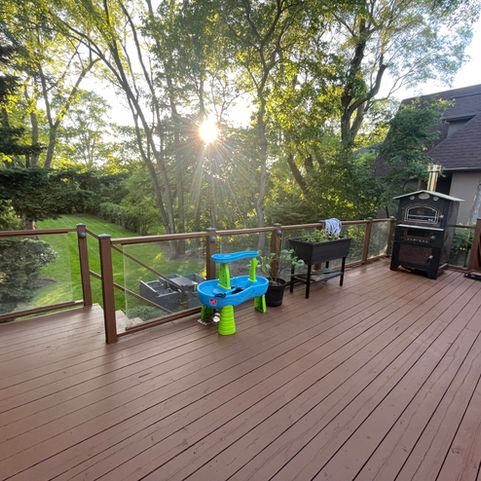 The homeowners wanted to cover their old deck for a few years before replacing it. We suggested applying a solid-stain which is a quick and cost effective option.