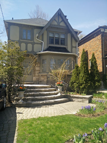 Leaside, Toronto - Exterior painting of the stucco siding, wood trim and fascia boards of a tudor-style home