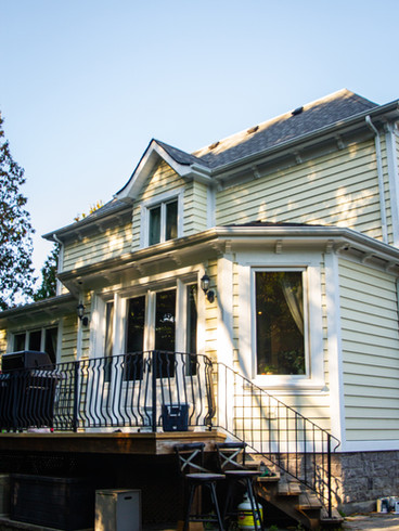 We restored the wood siding on this beautiful home in Toronto using a solid-stain