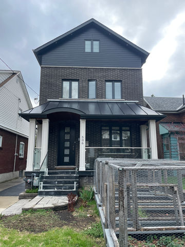 Bloor West Village, Toronto - Exterior painting of exterior siding of a house in Bloor West. This project required a 40ft ladder and working at heights