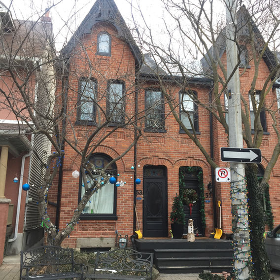 Exterior painting of a victorian styled home in Leslieville. We painted the old windows, porch and trim on the third storey peak of both homes. The old paint was peeling heavily and so needed to be scraped, sanded and primed.