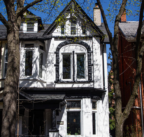 We refreshed this old Victorian home in downtown Toronto by painting the wood trim and brick. Our team scraped off all of the loose paint and gave the house a new colour scheme to give it a modern look.
