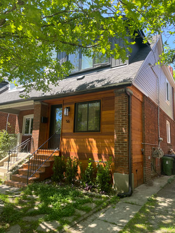 The Beaches, Toronto - Our team sprayed the vinyl windows & siding. We stripped the old wood stain on the wood siding and refinished it with wood oil