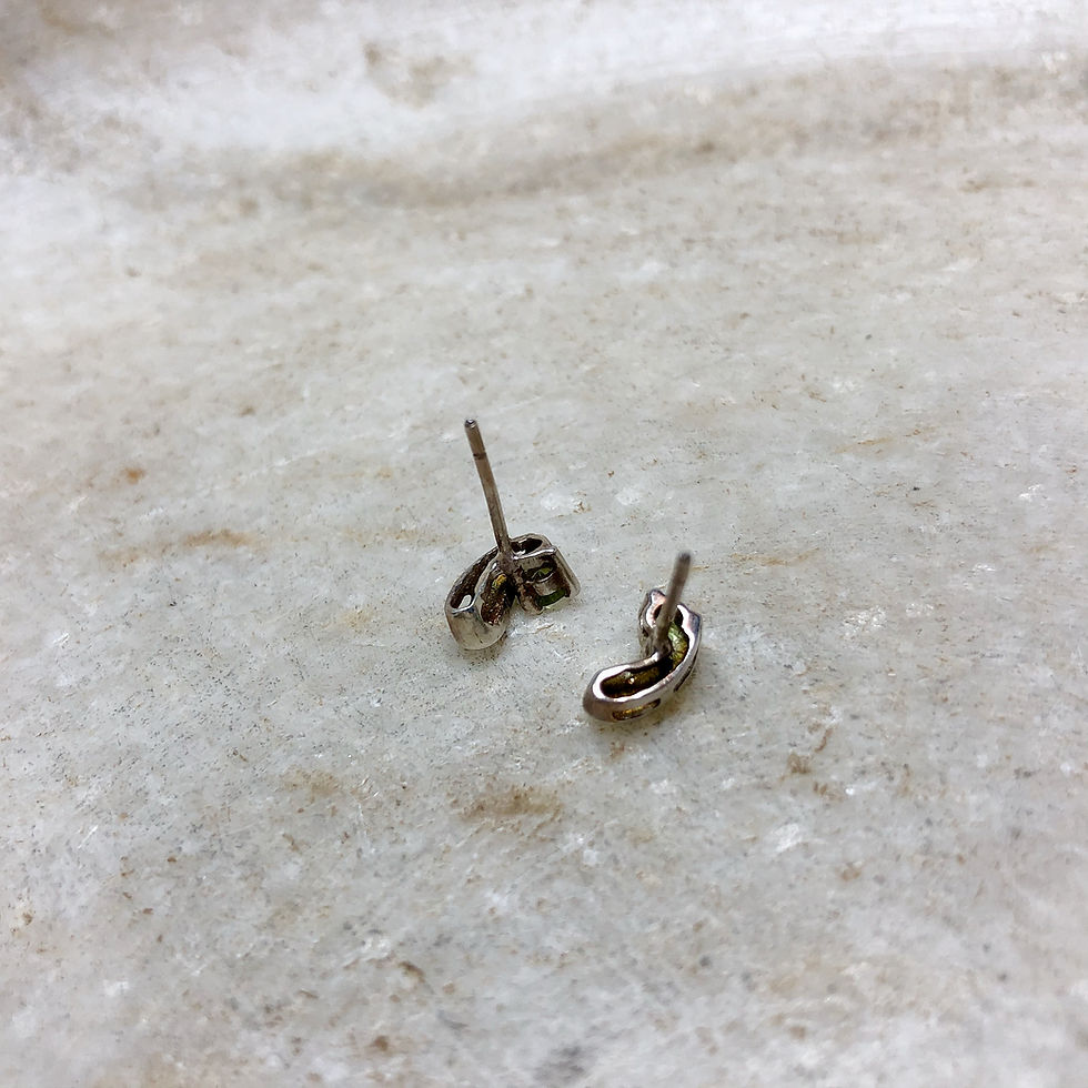 Thumbnail: Peridot star silver stud earrings