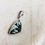 Thumbnail: Chinese writing rock silver pendant