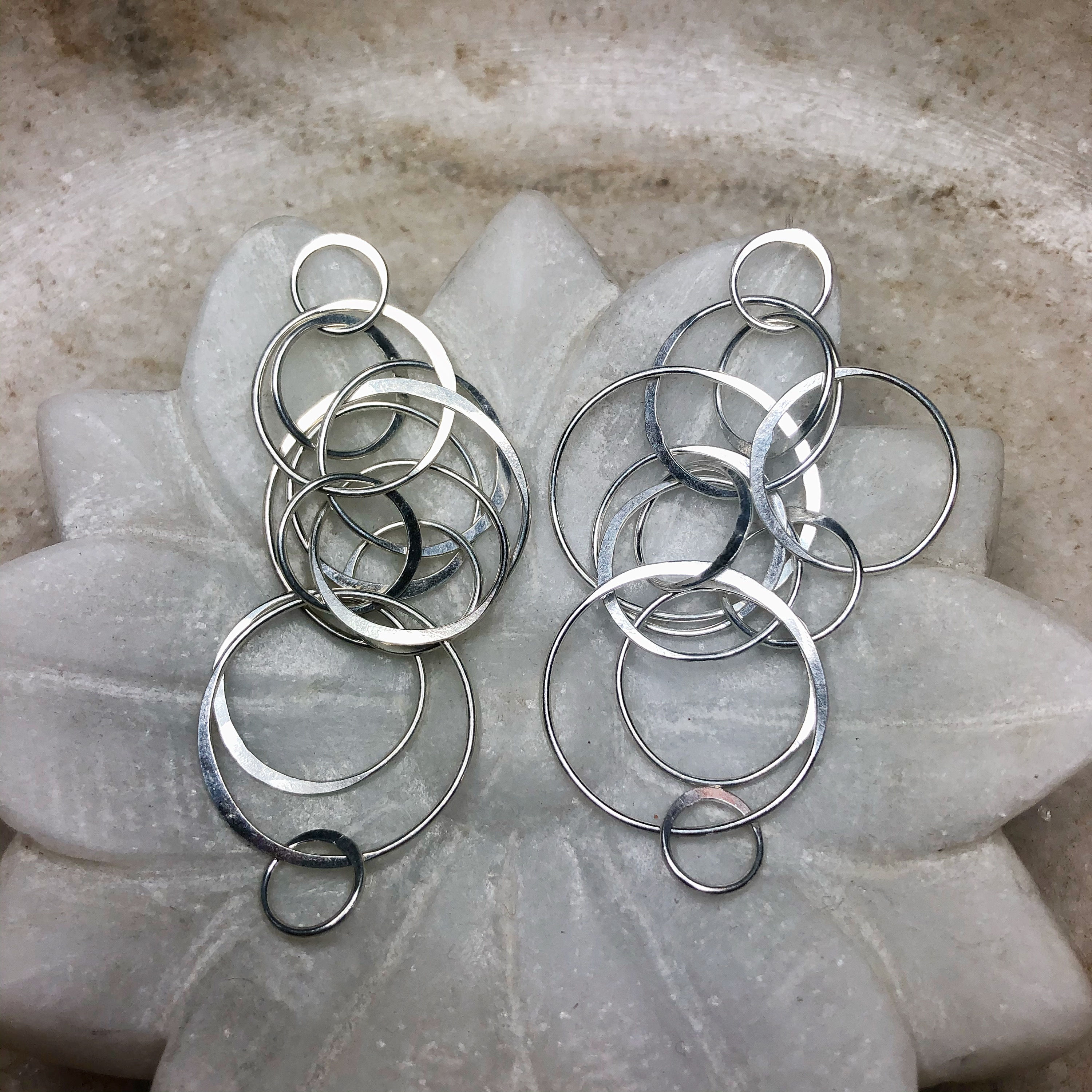 Tumbling circles silver post earrings