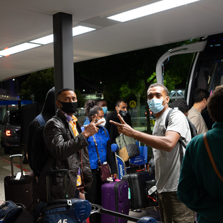 Suli (Suliasi) and Simione striking poses before jumping on the coach. It was a long day for all of us but everyone didn't forget to smile at the camera.