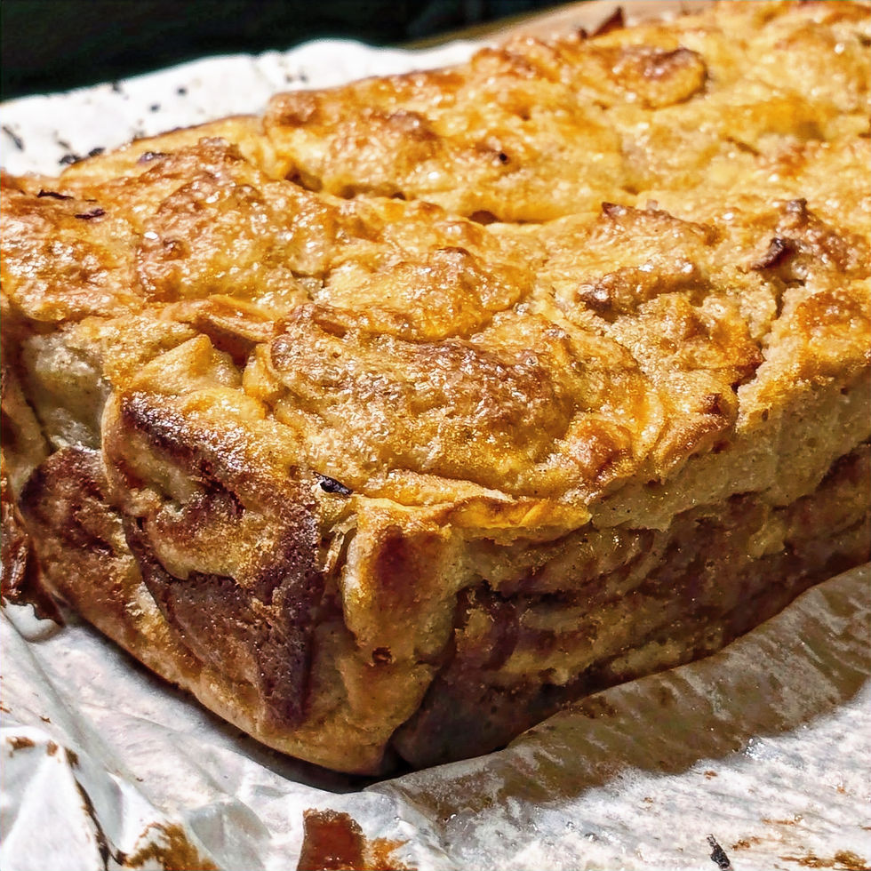 A cooked Invisible Apple Cake on parchment paper