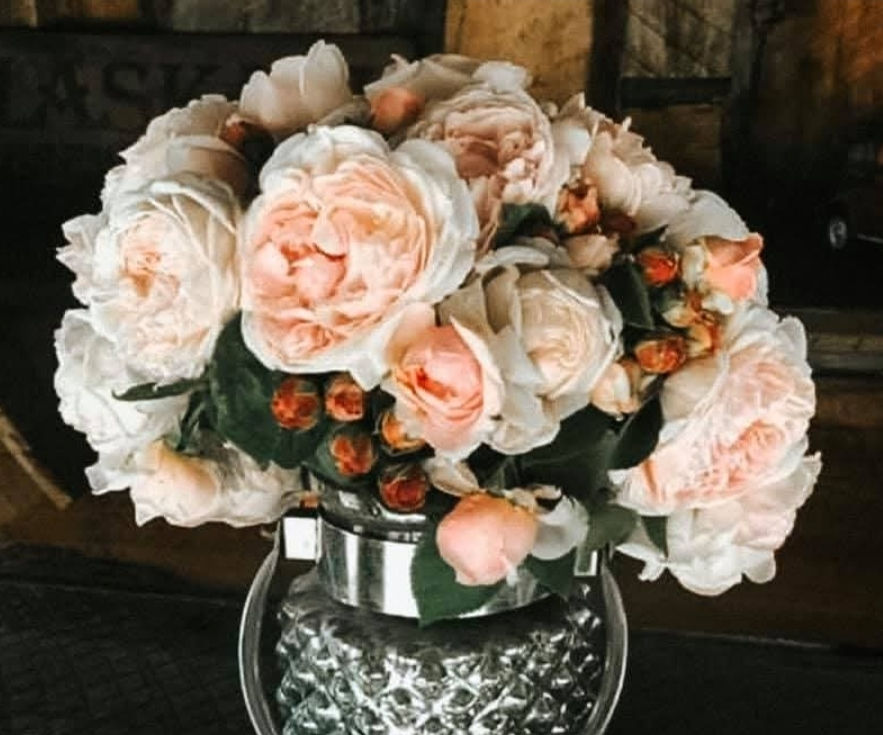 Thumbnail: This photo is of the rose AUSwith arranged in a glass vase as a bouquet. Very soft pink in color.