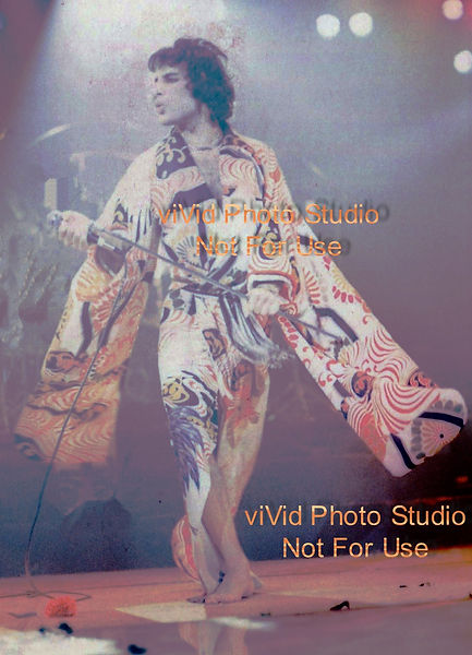 Live concert photo of glam rock Killer Queen Fairy Mercury in one of many Freddie Mercury's 1970s looks. Japanese kimono.