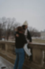 Winter couple session in a snowy field edited with Jaide & Jett presets, showing a moody film look created by stacking Natural Pack Preset 5 with Nostalgic and Western Fade.