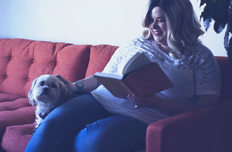 White plus size woman smiling while read