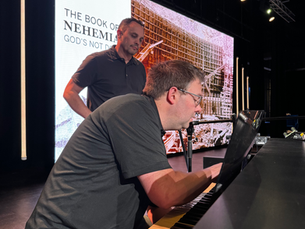 Technician checking a keyboard source before a church service