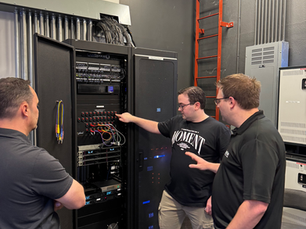 Ignite working alongside church team members at an equipment rack