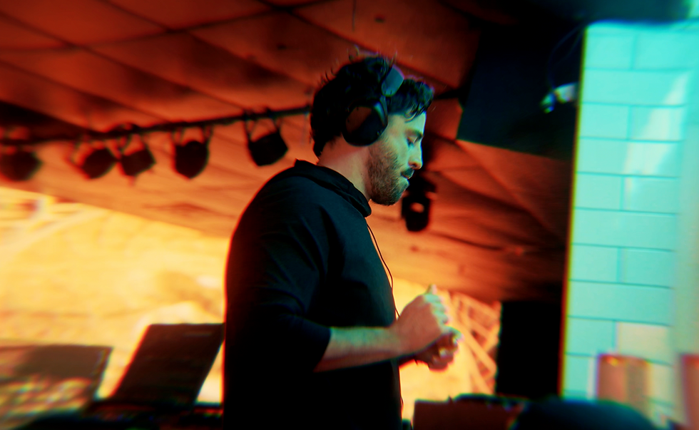 Alex Donofrio performing as a DJ, representing the progressive vocal trance sound of “Running In Circles.”