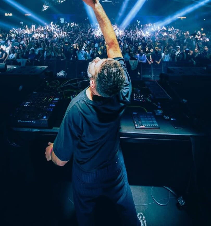 NTO performing live in front of a large crowd.