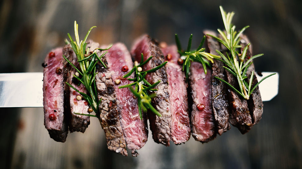 Two barbecue dry aged Kobe roast beef as close-up on a grillage